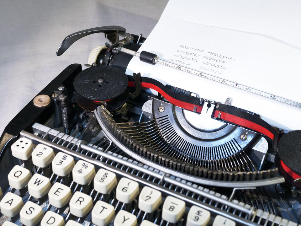 Olympia Splendid 33 typing sample QWERTY typeface black typewriter