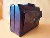 Leather attache case detail brown texture and hardware close-up