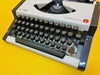 Olympia Traveller De Luxe Typewriter – Snow White – Elegant Script Edition