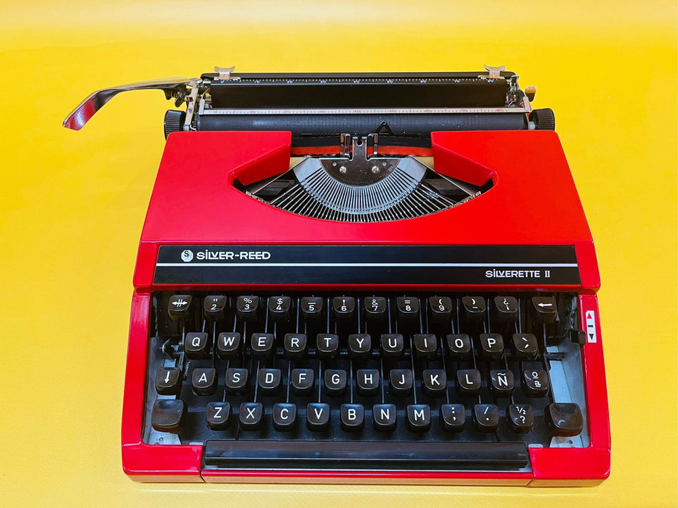 Detailed shot of the Spanish QWERTY keyboard on a red Silverette II featuring the iconic Ñ key and black keycaps