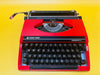 Detailed shot of the Spanish QWERTY keyboard on a red Silverette II featuring the iconic Ñ key and black keycaps