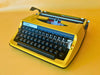 Brother Deluxe 800 yellow portable typewriter qwertz