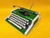 Working typewriter Olympia Traveller De Luxe green front view with case