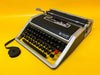 Olivetti Lettera DL black portable manual typewriter Spanish layout