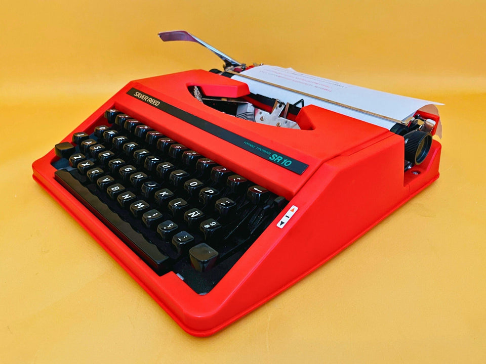 Silver Reed SR10 red portable typewriter QWERTY