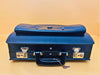 Black leather briefcase detail texture stitching and hardware close-up