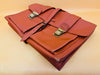 Faux leather travel bag detail brown texture and stitching close-up