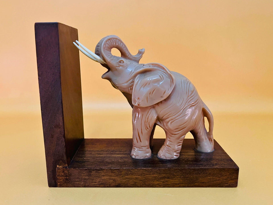 Vintage wooden elephant bookend on shelf book support decor