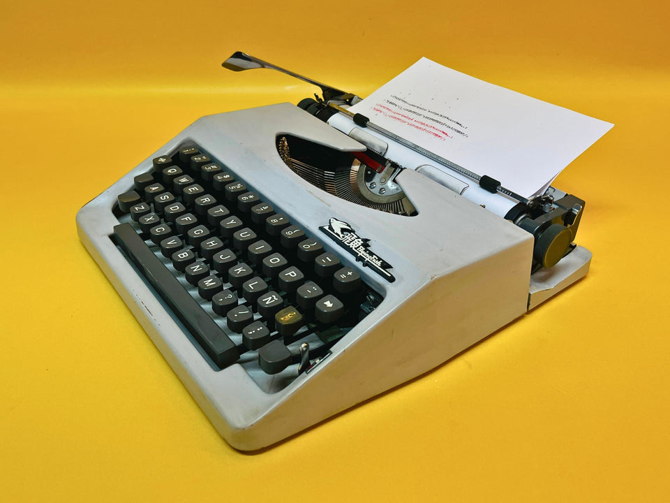 Flying Fish gray portable typewriter QWERTY