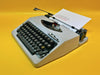 Flying Fish gray portable typewriter QWERTY