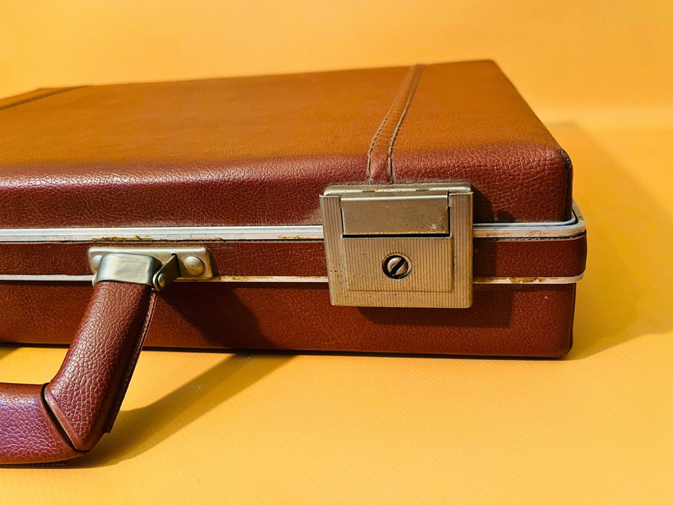 Close-up of vintage case latch and handle hardware
