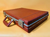 Vintage brown faux leather hard case, front view