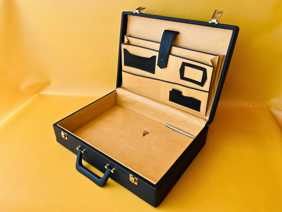 Vintage briefcase interior with pockets keys and pen