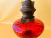 Close-up of antique oil lamp burner marked LEmpereur and Bernard Brevete