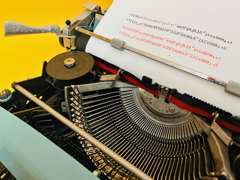 Crisp black and red ink type sample on white paper produced by this vintage Olivetti Lettera 32 typewriter.