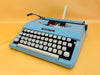 Imperial 200 cyan portable typewriter QWERTY