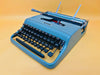 Working typewriter Olivetti Pluma 22 blue front view with case
