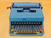 Detailed shot of the Spanish QWERTY keyboard on an Olivetti Lettera 32 featuring the Ñ key and round white keys