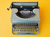 Detailed shot of the metal-rimmed glass keys on a Hispano Olivetti Studio 46 featuring the Spanish QWERTY layout and Ñ key