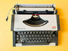 Detailed shot of the Spanish QWERTY keyboard on a white Olympia Traveller Deluxe featuring the Ñ key and original black keycaps.