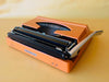 Silver Reed 280 | Safety Orange | The Ultimate 1970s Metal Pop-Art Icon