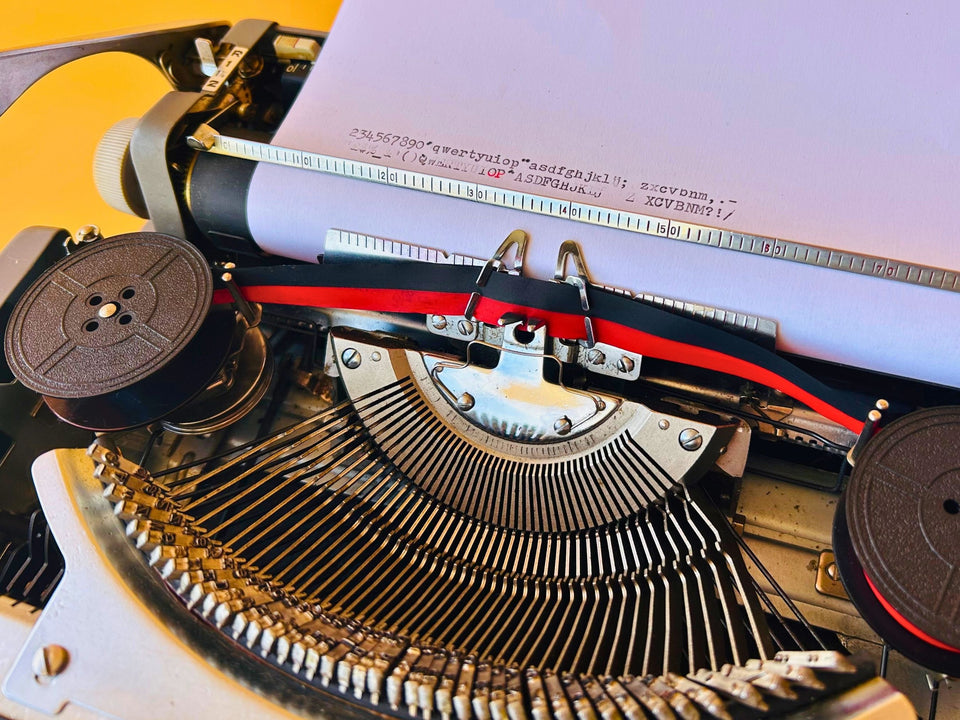 Brother Typewriter (1970s) – Gray Portable Manual Typewriter with Leather Case