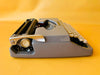 Brother Typewriter (1970s) – Gray Portable Manual Typewriter with Leather Case