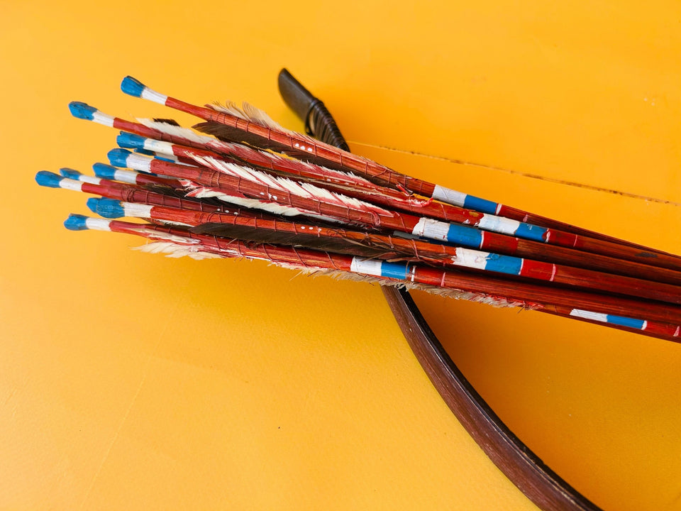 Handcrafted bow and arrows detail wood and string close-up
