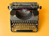 Detailed macro shot of the authentic Spanish QWERTY glass keys on a Continental Klein featuring metal rims and the Ñ key
