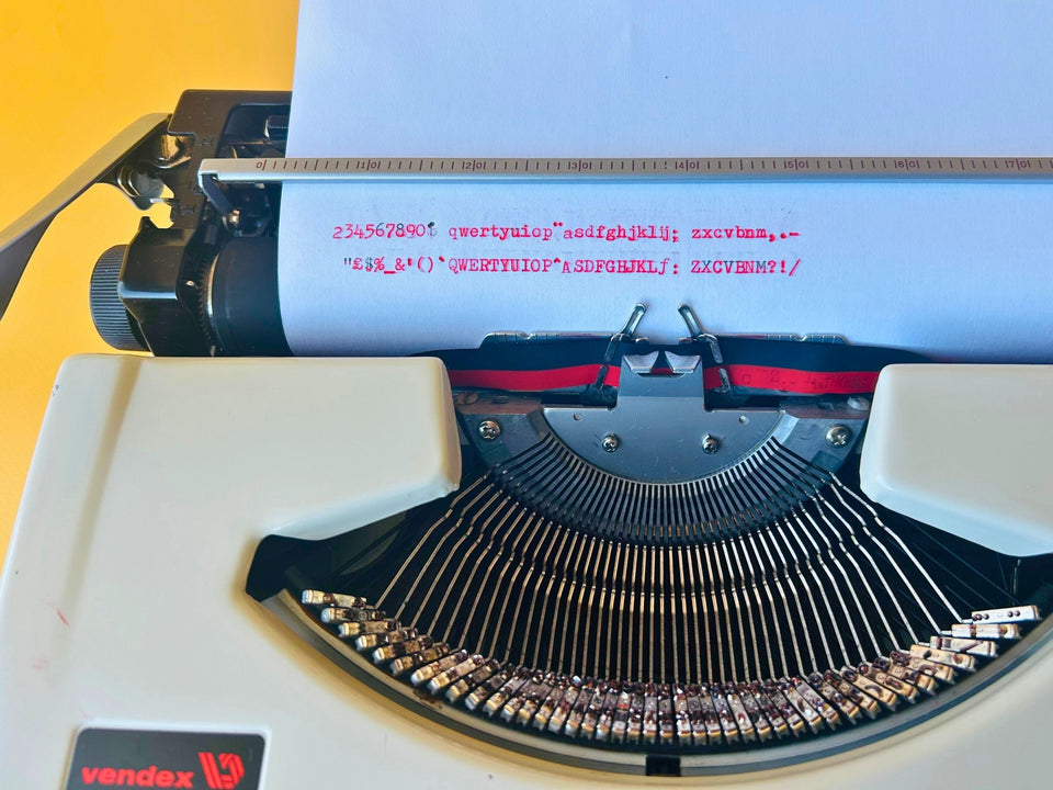 Macro shot of the paper showing the clean, professional typeface and serial number J23492920 of this Vendex 100.