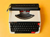 Detailed shot of the Spanish QWERTY keyboard on a Brother Deluxe 250 TR showing the Ñ key and specialized red control keys
