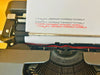 Side profile of the Olivetti Lettera 35 highlighting its bold, angular 1970s design and matte finish.