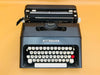 Detailed shot of the Spanish QWERTY keyboard on a black Lettera 35 showing the Ñ key and the signature red tab key.