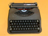 Detailed shot of the circular mint-green keys on a Swiss-made Hermes Baby featuring the Spanish QWERTY layout and Ñ key