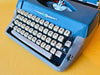 Amaya Deluxe Typewriter – 1970s Blue & Beige Portable Manual Typewriter with Case