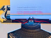 Close-up of the rear tabulator mechanism and the cleanly stamped serial number D4605313 on the steel frame.