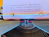 Side profile highlighting the pristine, unscuffed gloss finish of the two-tone plastic body panels on this fully serviced typewriter.