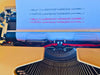 Detailed view of the original vintage hardshell carrying case and accompanying integrated keyholder accessory included with the Kovac typewriter.