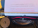 Detailed macro view of the Spanish QWERTY keyboard on a Torpedo Modell 6 showing the unique circular keys, white lettering, and the 'Ñ' key alignment.
