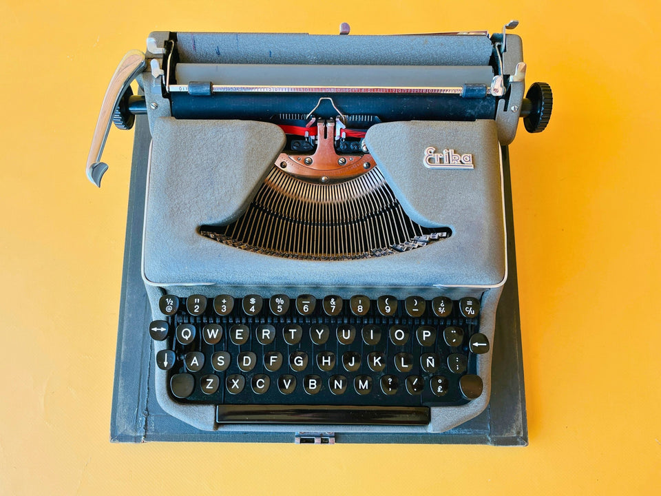 Vintage German Erika Model 100 manual typewriter in excellent condition with original brushes