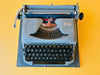 Vintage German Erika Model 100 manual typewriter in excellent condition with original brushes