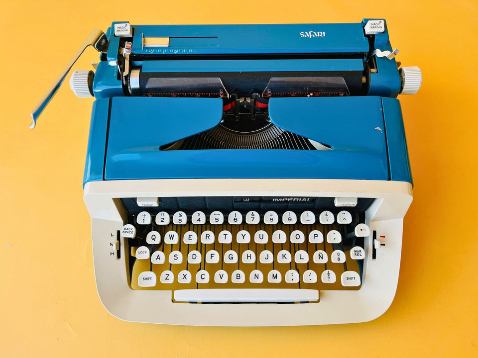 Vintage Imperial Safari manual typewriter in blue color fully working