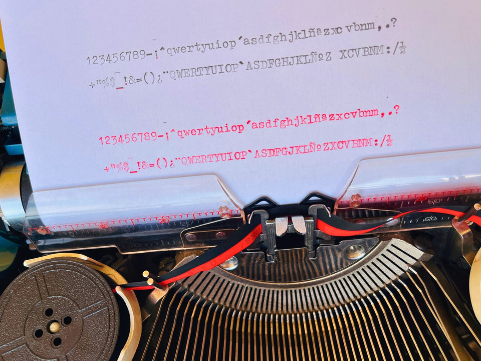 Imperial Safari Spanish QWERTY typewriter with black and red ribbon installed