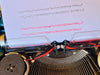 Imperial Safari Spanish QWERTY typewriter with black and red ribbon installed