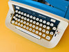 Imperial Safari Typewriter | Blue & White Portable Manual Typewriter | Spanish QWERTY | Serial S49 056912