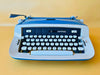 Imperial Safari Typewriter | Blue & White Portable Manual Typewriter | Spanish QWERTY | Serial S49 056912