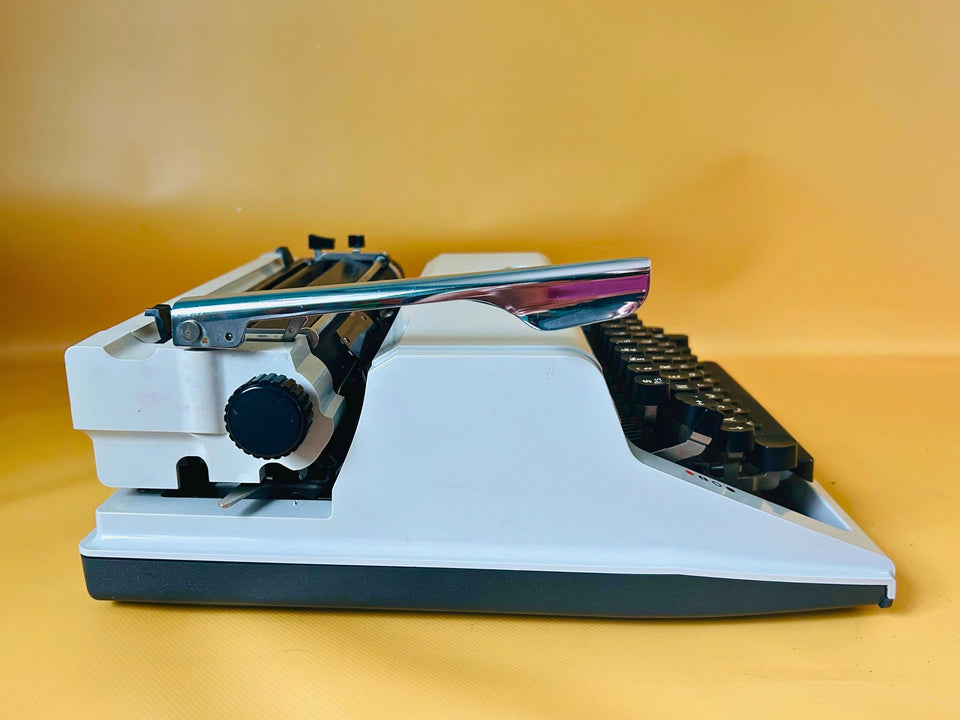 Erika Mod. 100 Typewriter | Spanish QWERTY Portable Manual Typewriter | Black Leather Case | Made in GDR