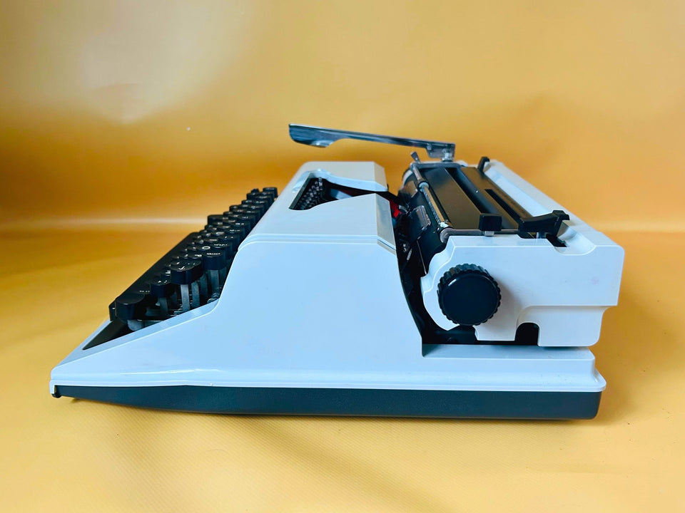 Erika Mod. 100 Typewriter | Spanish QWERTY Portable Manual Typewriter | Black Leather Case | Made in GDR