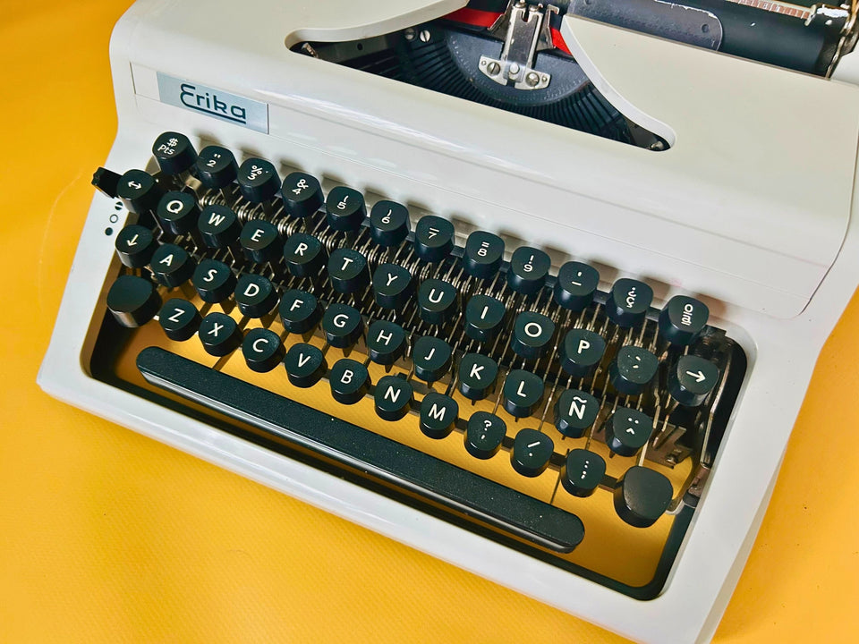 Erika Mod. 100 Typewriter | Spanish QWERTY Portable Manual Typewriter | Black Leather Case | Made in GDR