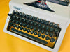 Erika Mod. 100 Typewriter | Spanish QWERTY Portable Manual Typewriter | Black Leather Case | Made in GDR
